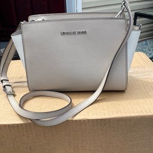 Michael Kors Grey and White Crossbody purse.